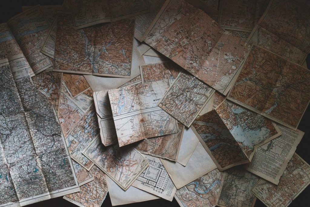 Old maps scattered across a flat surface